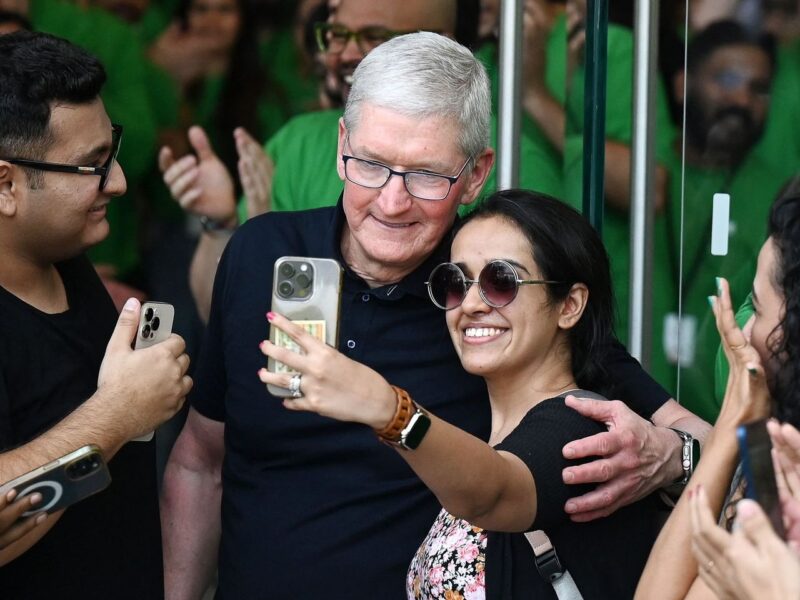 Apple fans touch CEO Tim Cook's feet at Delhi store